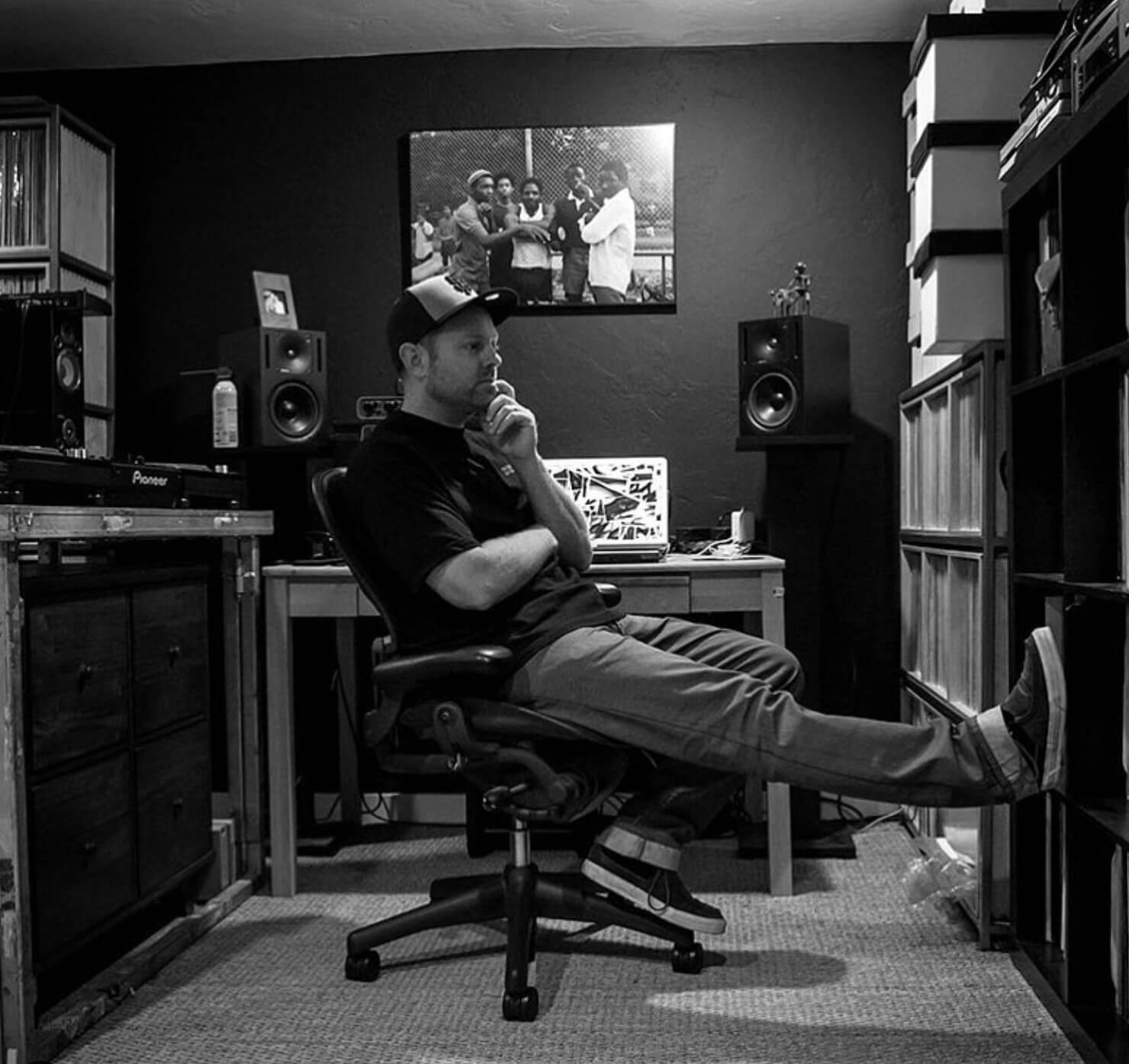 dj shadow sitting at a desk