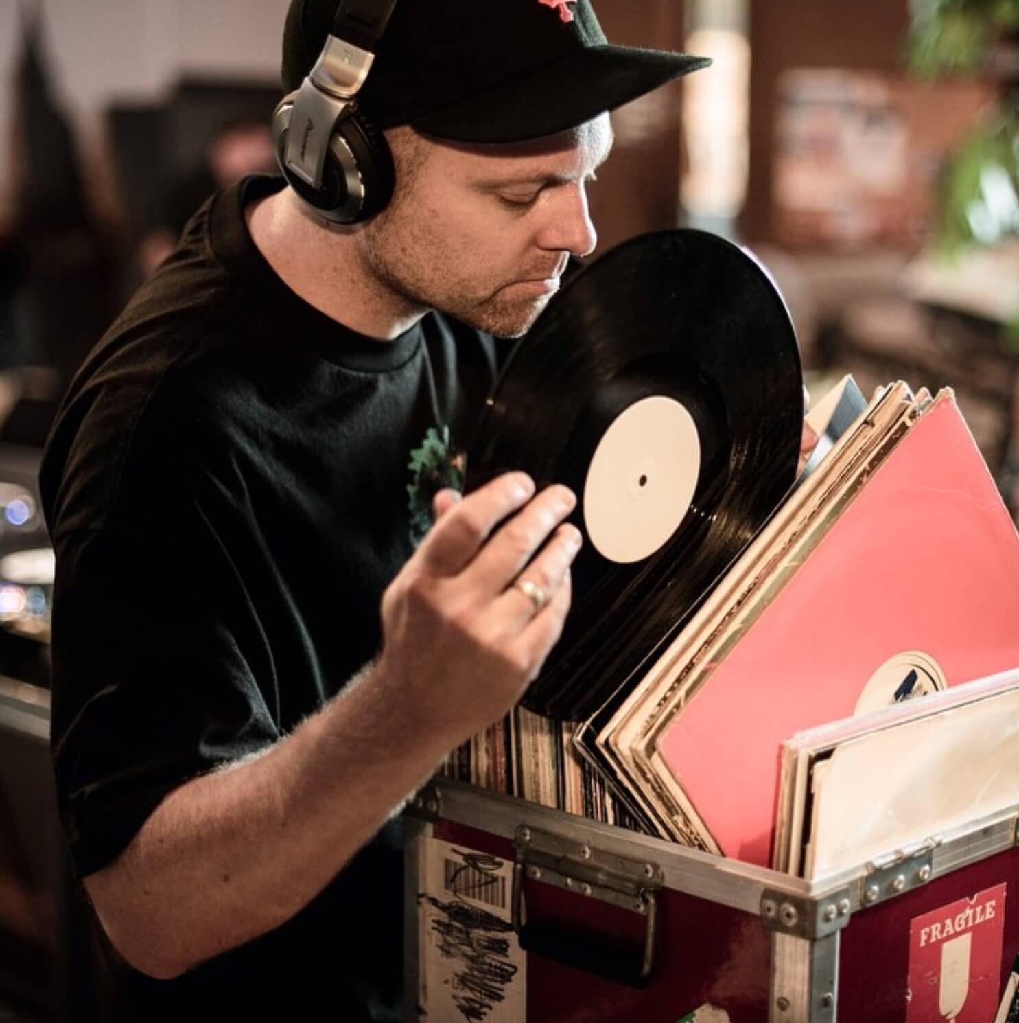 dj shadow looking through vinyl records